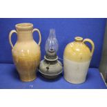 STONEWARE FLAGON, STONEWARE JUG AND A PARAFFIN LAMP