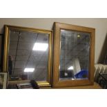 TWO FRAMED MIRRORS THE LARGEST 70 CM X 55 CM