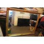 A LARGE GILT MIRROR 138 CM X 104 CM