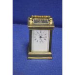 A BRASS FRENCH MAID CARRIAGE CLOCK