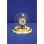 A KERN GLASS DOMED MANTLE CLOCK