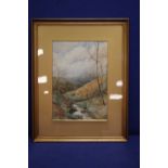 A FRAMED WATERCOLOUR OF A COUNTRYSIDE SCENE SIGNED TO THE LOWER RIGHT