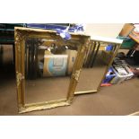 TWO FRAMED MIRRORS THE LARGEST 90 CM X 65 CM