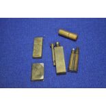 FIVE TRENCH ART TYPE BRASS LIGHTER, INCLUDING AN UNUSUAL ROOK TYPE