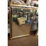 A FRAMED MIRROR 102 CM X 73