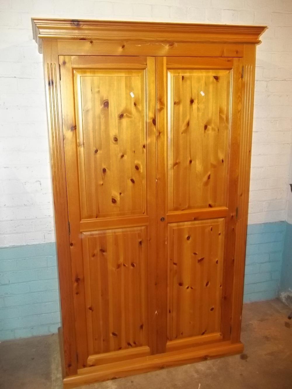 A SOLID PINE 2 DOOR DOUBLE WARDROBE (NO KEY)