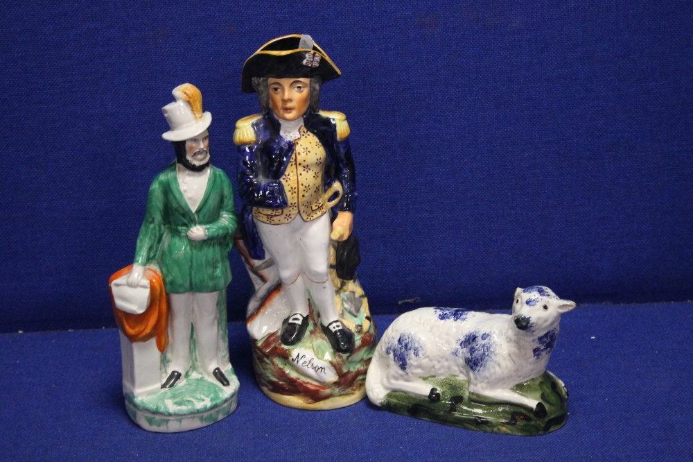TWO CONTINENTAL STYLE FIGURES TOGETHER WITH A STAFFORSHIRE STYLE FIGURE OF A SHEEP