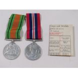 TWO BOXED MEDALS TO INC 1939 / 1945 DEFENCE MEDAL (BOTH UN ENGRAVED)