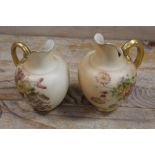 A ROYAL WORCESTER SMALL BLUSH IVORY JUG TOGETHER WITH ANOTHER - THE SECOND HAVING DAMAGES