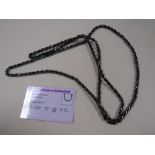 A BOXED LONG LENGTH HAEMATITE SINGLE STRAND BEAD NECKLACE WITH C.O.A.