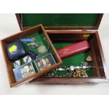 A WOODEN BOX OF COLLECTABLES AND BADGES ETC SURMOUNT WITH CARVED WOODEN FROG