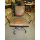 A MODERN BROWN LEATHER SWIVEL OFFICE CHAIR