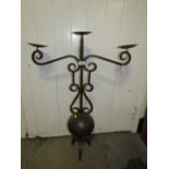 A LARGE WROUGHT IRON DECORATIVE THREE BRANCH CANDELABRA