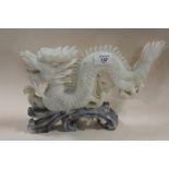 AN ORIENTAL CARVED SOAPSTONE DRAGON