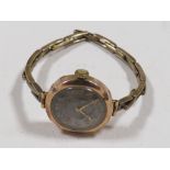 A 9CT GOLD CASED LADIES WATCH ON BASE METAL EXPANDING STRAP
