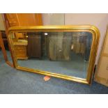 A LARGE MODERN GILT ARCHED OVERMANTLE MIRROR H-85 W-142 CM