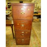 A VINTAGE OAK EFFECT FOUR DRAWER FILING CABINET