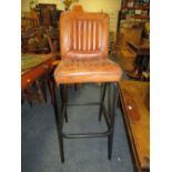 A TAN LEATHER BAR STOOL