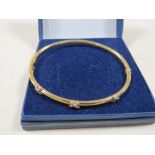 A 9CT GOLD BANGLE MARKED 375, APPROX WEIGHT 4.4g