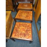 A MID CENTURY TILE TOP NEST OF TABLES