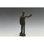 A BRONZE TYPE FIGURE OF A POLICEMAN, H 16.5 cm