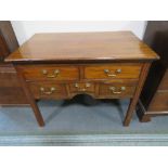 AN ANTIQUE MAHOGANY FIVE DRAWER LOW BOY, raised on straight supports, H 72 cm, W 89 cm