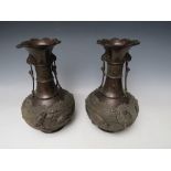 A PAIR OF LATE 19TH / EARLY 20TH CENTURY BRONZE ORIENTAL VASES, of baluster outline, each