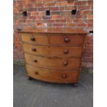 A 19TH CENTURY MAHOGANY BOW FRONTED CHEST OF TWO SHORT ABOVE THREE LONGER GRADUATED DRAWERS, with