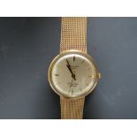 A HALLMARKED 9 CARAT GOLD LONGINES FLAGSHIP AUTOMATIC WRIST WATCH, approx weight 57.8g, Dia 3.5 cm