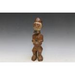 A CARVED WOODEN AFRICAN TRIBAL FIGURE, H 30 cm