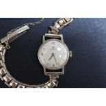 OMEGA - A HALLMARKED 9 CARAT GOLD LADIES WRIST WATCH, with an Omega box, presentation engraving to