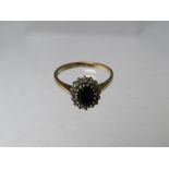 A HALLMARKED 9CT GOLD SAPPHIRE AND DIAMOND CLUSTER DRESS RING, ring size P, approximate weight 3.2