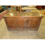 AN 18TH CENTURY OAK PANELLED COFFER, with lozenge carved frieze, H 71 cm, W 136 cm