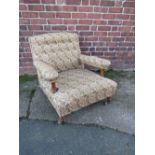 A LARGE UPHOLSTERED OPEN ARMCHAIR, in the style of Howard & Sons, the back leg stamped '4470 4072'