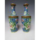 A PAIR OF EARLY 20TH CENTURY ORIENTAL CLOISONNE VASES, enamelled with floral detail, H 23 cm (2)