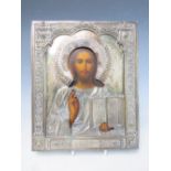 A 19TH CENTURY RUSSIAN ICON WITH WHITE METAL OKLAD, inscribed verso 'To The Spiritual Leader of