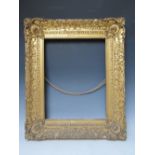 AN 18TH CENTURY DECORATIVE GOLD FRAME WITH CORNER EMBELLISHMENTS, frame W 10 cm, frame rebate 47 x