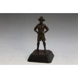 A BRONZE TYPE FIGURE OF A BOY SCOUT, H 14 cm