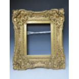 A LATE 18TH / EARLY 19TH CENTURY GOLD SWEPT FRAME, frame W 16 cm, frame rebate 42 x 33 cm