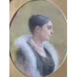 M.B. (XX). An oval portrait study of a lady with a pearl necklace, signed with monogram verso,