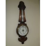 AN EARLY 20TH CENTURY CARVED OAK ANEROID BAROMETER, H 90 cm