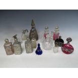 A COLLECTION OF SIXTEEN ASSORTED GLASS PERFUME BOTTLES, ATOMISERS, VANITY JARS ETC., to include a
