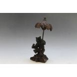 A BRONZE STYLE FIGURE OF A BEAR HOLDING A PARASOL, H 20 cm