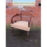 A 19TH CENTURY MAHOGANY ARMCHAIR, with scrolled arms and turned front supports