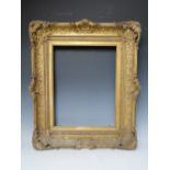 A LATE 18TH / EARLY 19TH CENTURY DECORATIVE GOLD SWEPT FRAME, with integral slip, frame W 11 cm,