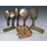 A COLLECTION OF HALLMARKED SILVER BACKED DRESSING TABLE SETS, comprising a four piece set, a