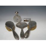A HALLMARKED SILVER LIDDED GLOBULAR PERFUME BOTTLE, (hallmarks rubbed), complete with glass stopper,