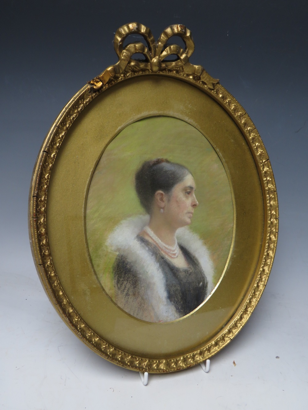 M.B. (XX). An oval portrait study of a lady with a pearl necklace, signed with monogram verso, - Image 3 of 4