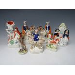 A COLLECTION OF SEVEN 19TH CENTURY STAFFORDSHIRE POTTERY, to include a pair of equestrian flatbacks,
