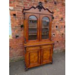 A 19TH CENTURY WALNUT GLAZED BOOKCASE, the upper section with twin glazed doors and carved moulded